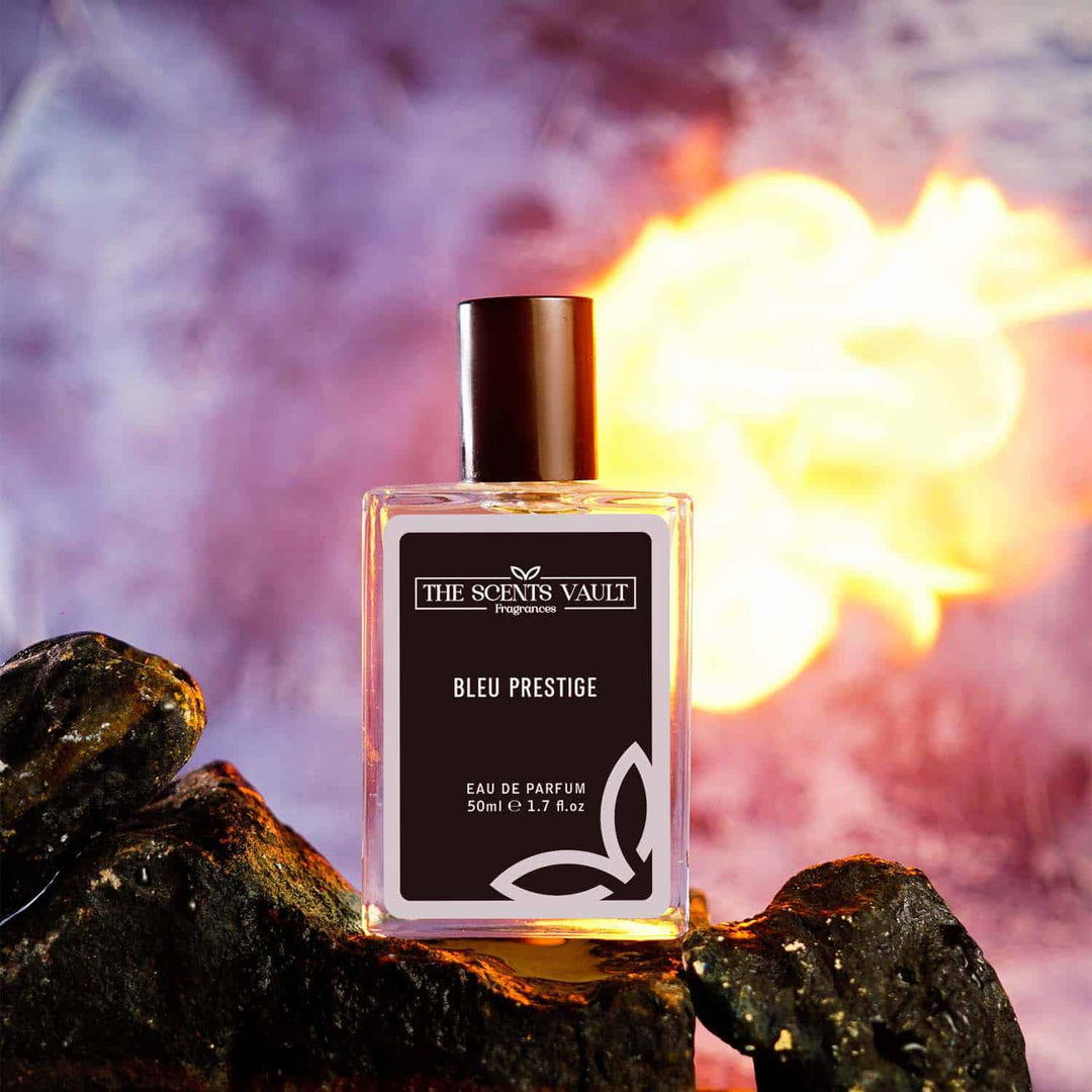 Bleu Prestige Eau de Parfum (50ml) from The Scents Vault, showcased against a fiery and smoky backdrop.