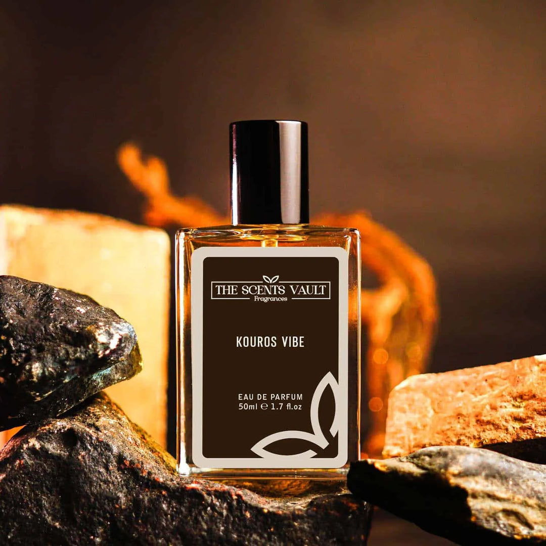 Kouros Vibe Eau de Parfum (50ml) from The Scents Vault, displayed with a rocky background and warm tones.