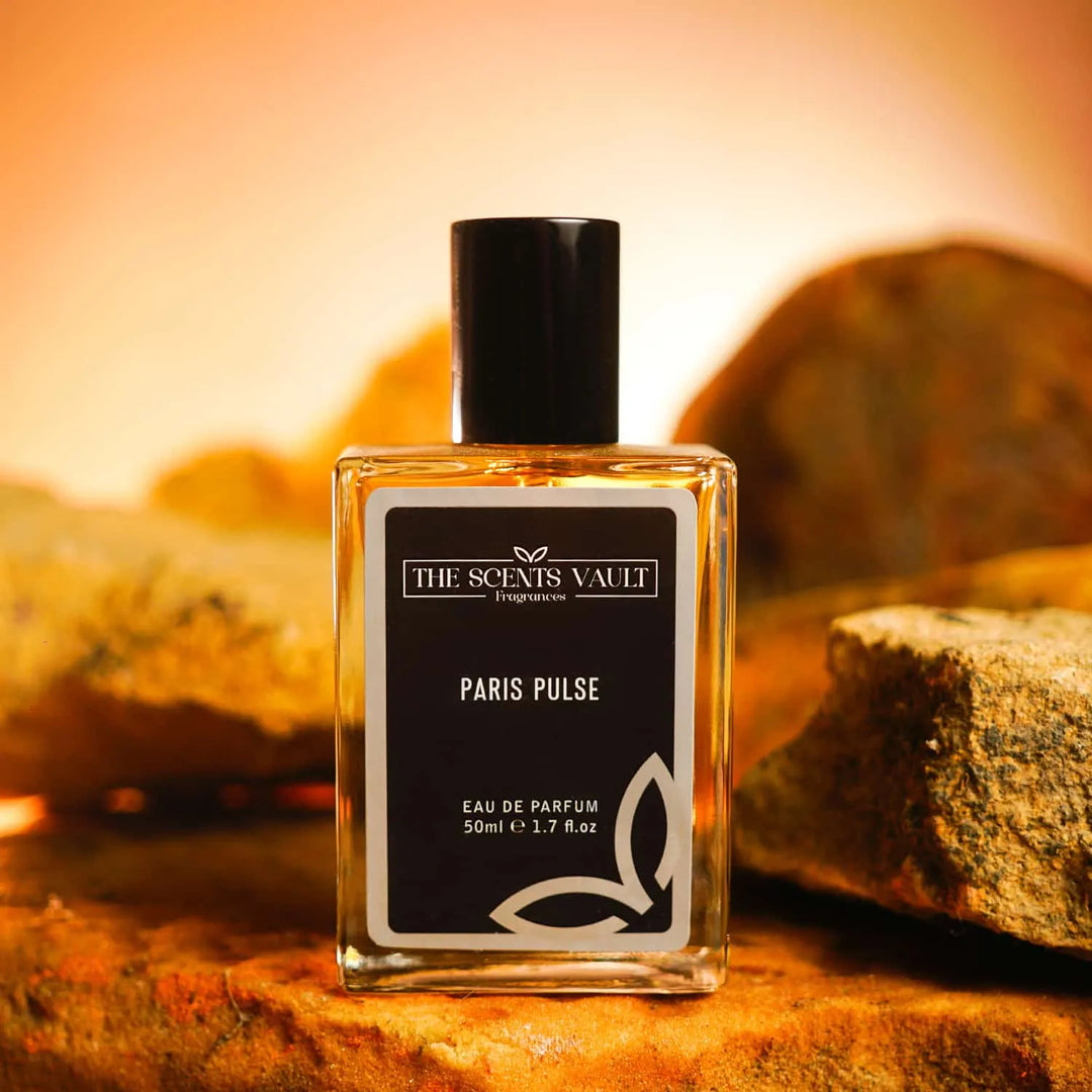 Paris Pulse Eau de Parfum (50ml) from The Scents Vault, displayed with a warm, rocky background.