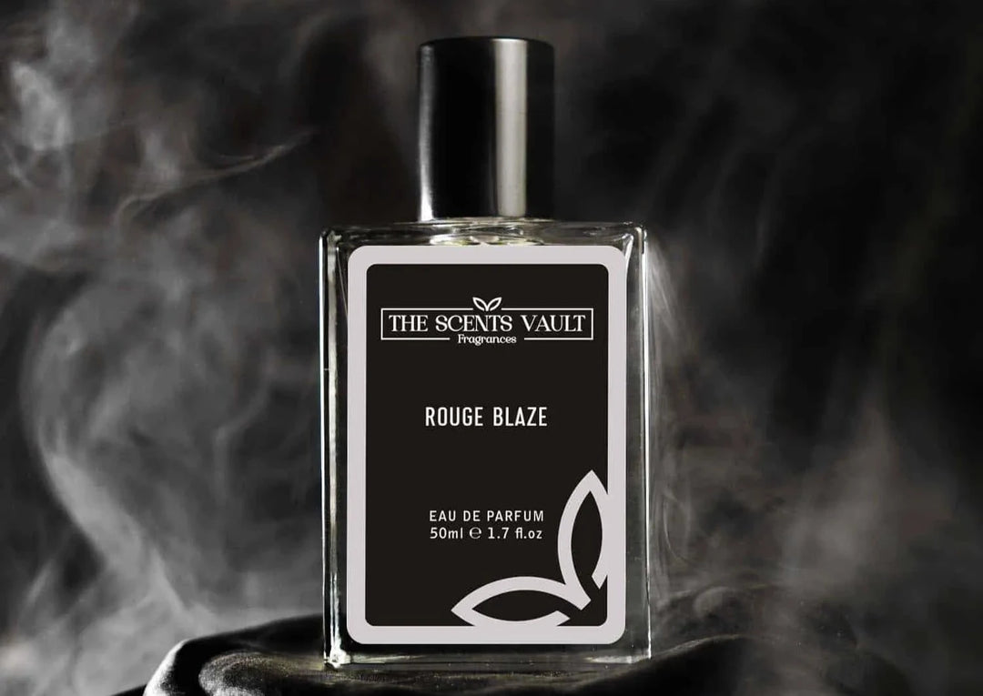 Rouge Blaze Eau de Parfum bottle from The Scents Vault, surrounded by mist, with the fragrance name and brand visible on the label.