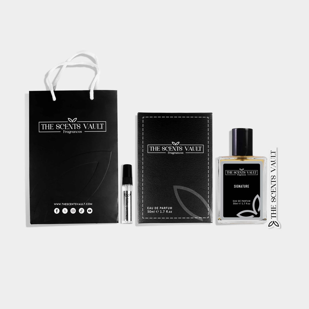 Signature fragrance set by The Scents Vault with perfume bottle, tester vial, black gift bag, box, and scent strip.