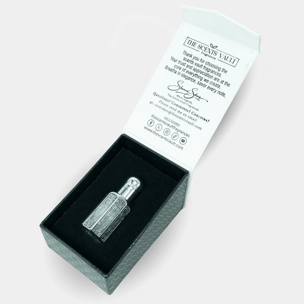 Small bottle shaped object in a box with a branded card on a white background