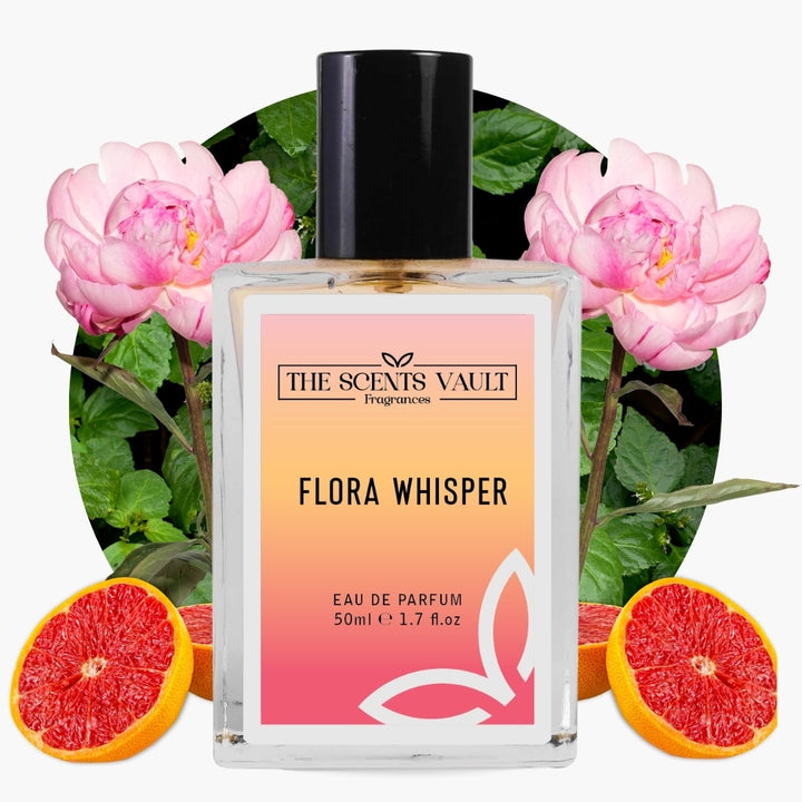 Perfume bottle labeled 'Flora Whisper' by 'The Scents Vault' with pink flowers and grapefruit slices in the background.