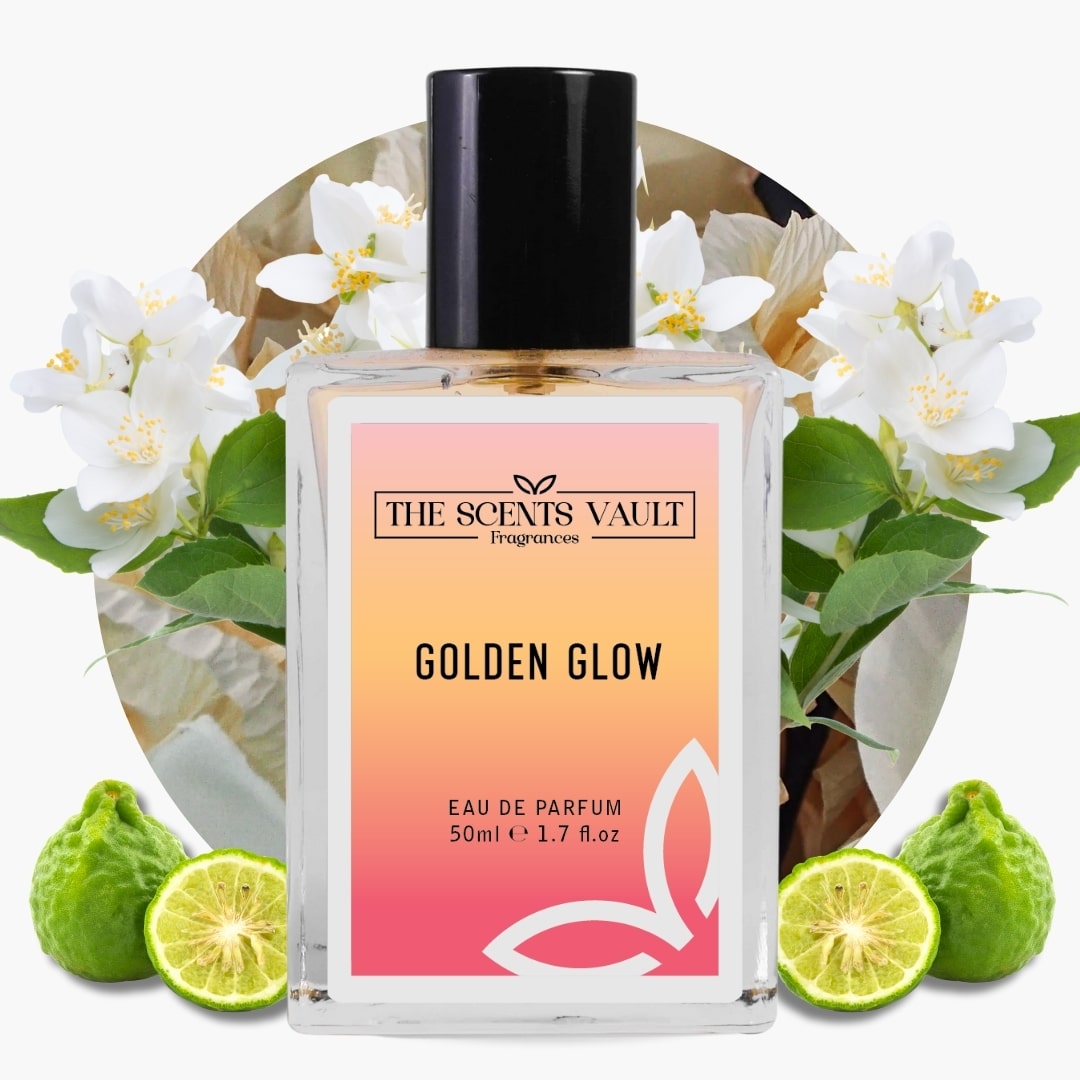 Perfume bottle labeled 'Golden Glow' by The Scents Vault with flowers and limes in the background
