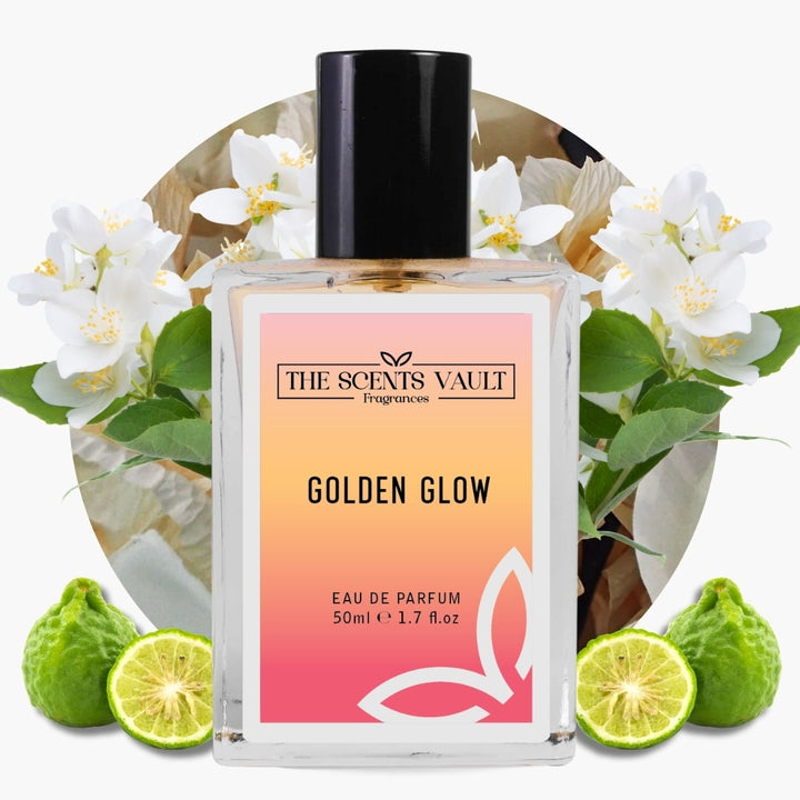 Perfume bottle labeled 'Golden Glow' by The Scents Vault with flowers and limes in the background