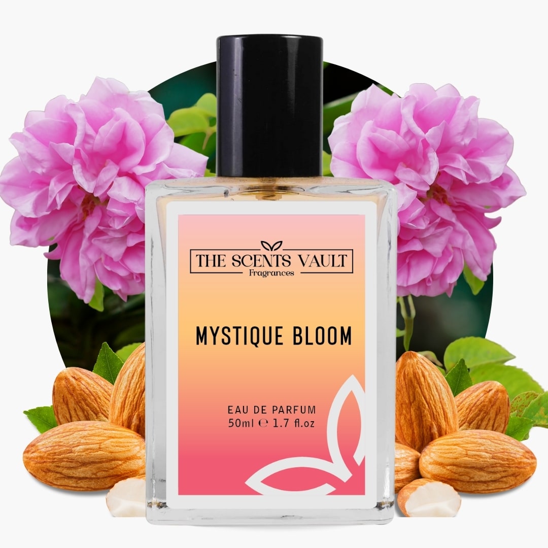 Perfume bottle labeled 'Mystique Bloom' by 'The Scents Vault' with pink flowers and almonds in the background.
